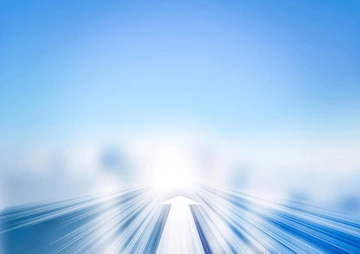 Abstract image of a bright light at the end of a pathway with motion blur effects.